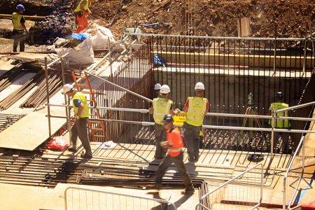 construction-workers-working-on-a-building-construction-site-in-downtown-london-england_t20_X23Vzr